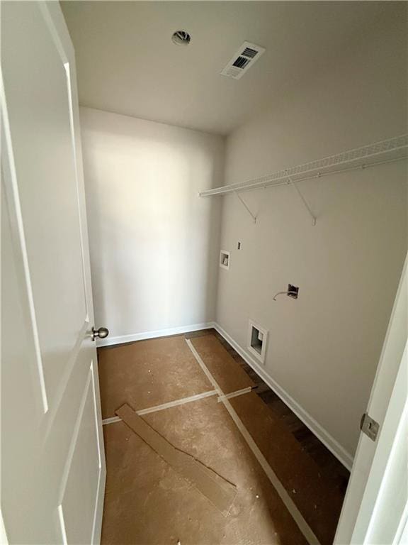 clothes washing area with visible vents, hookup for a washing machine, and laundry area