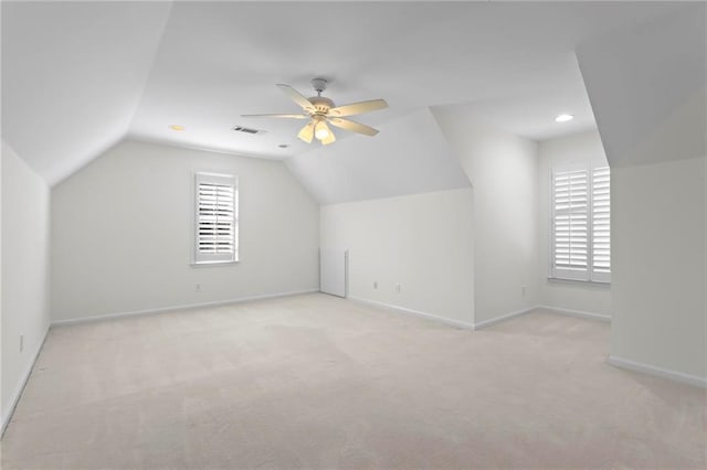 bonus room featuring visible vents, ceiling fan, baseboards, carpet, and lofted ceiling