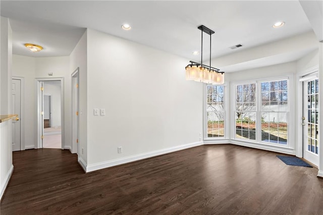 unfurnished dining area featuring recessed lighting, dark wood-style floors, visible vents, and baseboards