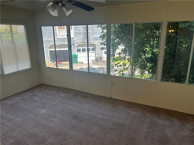 5000 Saxony Ct, Stone Mountain, GA 30083 - unfurnished sunroom with a ceiling fan and carpet floors
