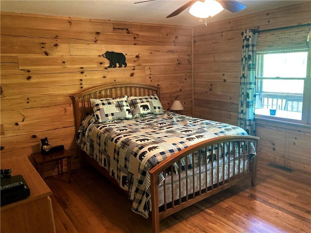 105 Ranch Mountain Ct, Dahlonega, GA 30533 - bedroom with wood finished floors, wood walls, and ceiling fan