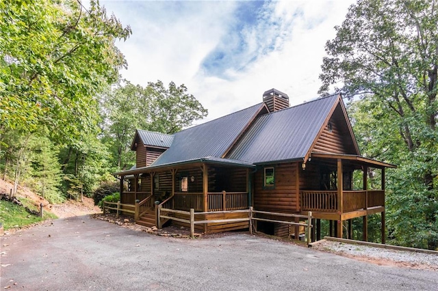 105 Ranch Mountain Ct, Dahlonega, GA 30533 - view of front of home with a porch, a chimney, and metal roof