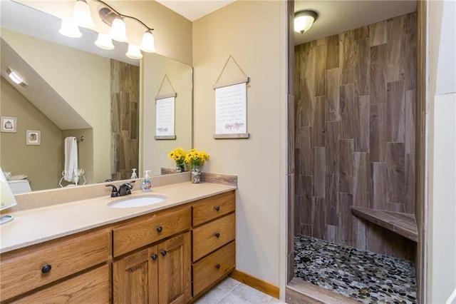 105 Ranch Mountain Ct, Dahlonega, GA 30533 - bathroom with vanity, a tile shower, and tile patterned flooring