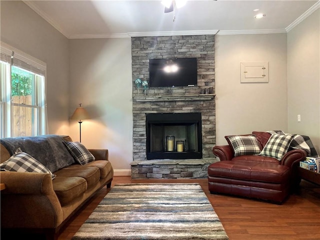 105 Ranch Mountain Ct, Dahlonega, GA 30533 - living room featuring wood finished floors, a ceiling fan, crown molding, baseboards, and a stone fireplace