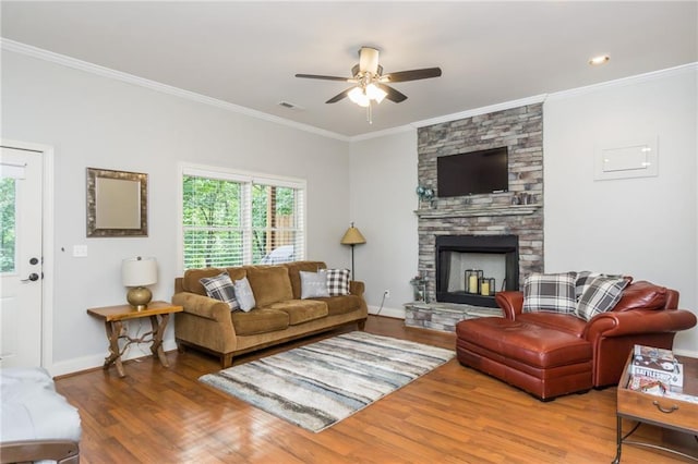 105 Ranch Mountain Ct, Dahlonega, GA 30533 - living area with ceiling fan, wood finished floors, crown molding, a fireplace, and baseboards