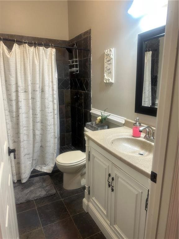 105 Ranch Mountain Ct, Dahlonega, GA 30533 - bathroom with toilet, vanity, and a tile shower