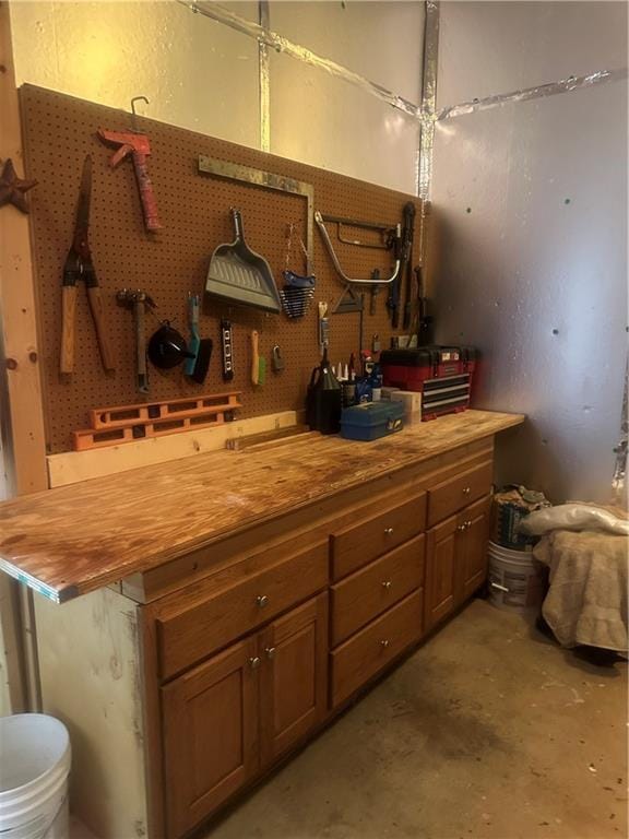 105 Ranch Mountain Ct, Dahlonega, GA 30533 - bathroom featuring a workshop area, unfinished concrete flooring, toilet, and vanity