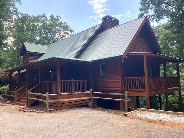105 Ranch Mountain Ct, Dahlonega, GA 30533 - view of front of property with covered porch, a chimney, metal roof, and faux log siding