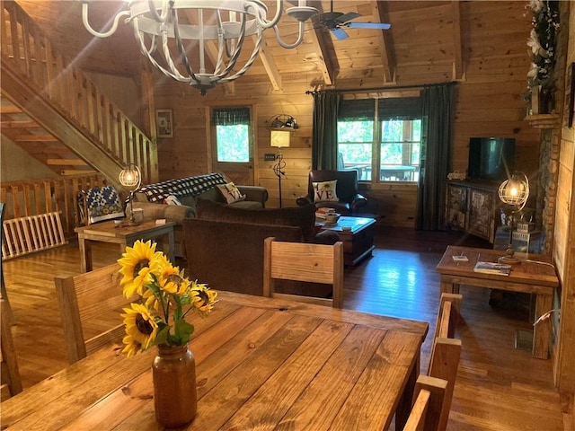 105 Ranch Mountain Ct, Dahlonega, GA 30533 - dining space with wood finished floors, wood walls, ceiling fan, a chandelier, and stairs