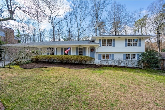 tri-level home with a front yard