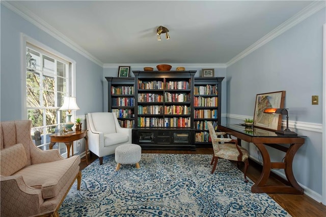 living area with ornamental molding, wood finished floors, and baseboards