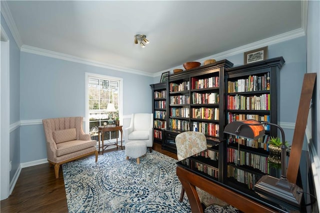 sitting room featuring crown molding, dark wood finished floors, and baseboards