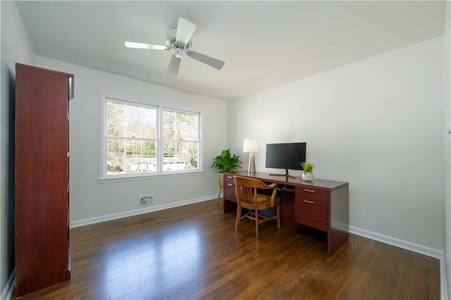 office with dark wood-style floors, baseboards, and a ceiling fan