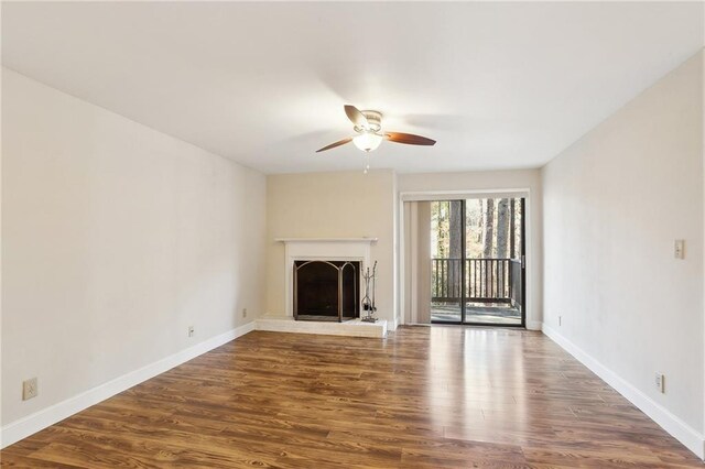 unfurnished room featuring hardwood / wood-style flooring, ceiling fan, and a textured ceiling