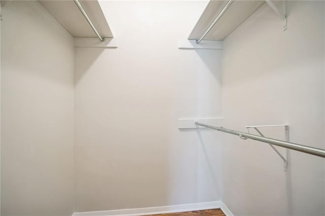 spacious closet featuring hardwood / wood-style floors