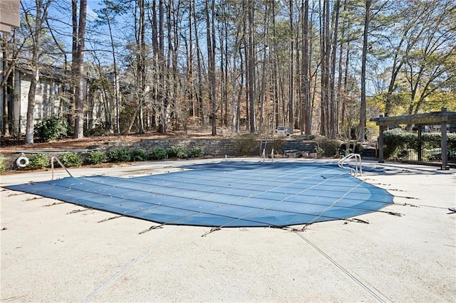 view of swimming pool featuring a patio area