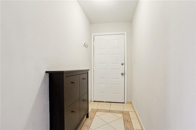 doorway featuring light tile patterned floors