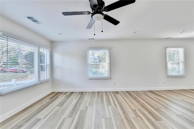 2502 Tupelo St SE, Atlanta, GA 30317 - spare room with light wood-style floors, plenty of natural light, baseboards, recessed lighting, and a ceiling fan