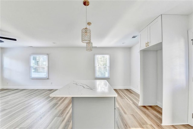 2502 Tupelo St SE, Atlanta, GA 30317 - kitchen with open floor plan, light wood-style floors, and a kitchen island
