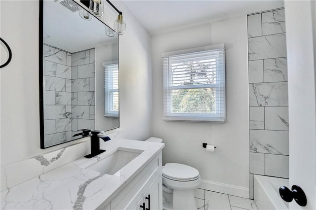 2502 Tupelo St SE, Atlanta, GA 30317 - bathroom featuring marble finish flooring, vanity, toilet, baseboards, and shower / bath combination