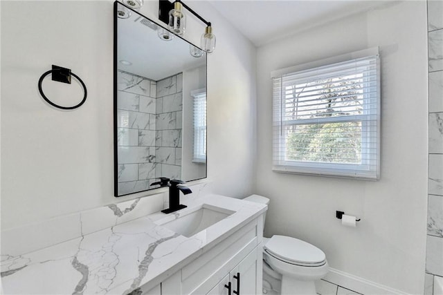 2502 Tupelo St SE, Atlanta, GA 30317 - full bath with vanity, toilet, and baseboards