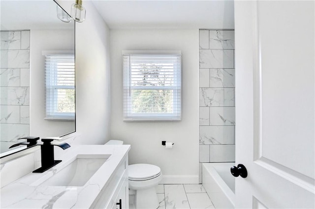 2502 Tupelo St SE, Atlanta, GA 30317 - full bath featuring marble look tiles, vanity, toilet, baseboards, and shower / washtub combination