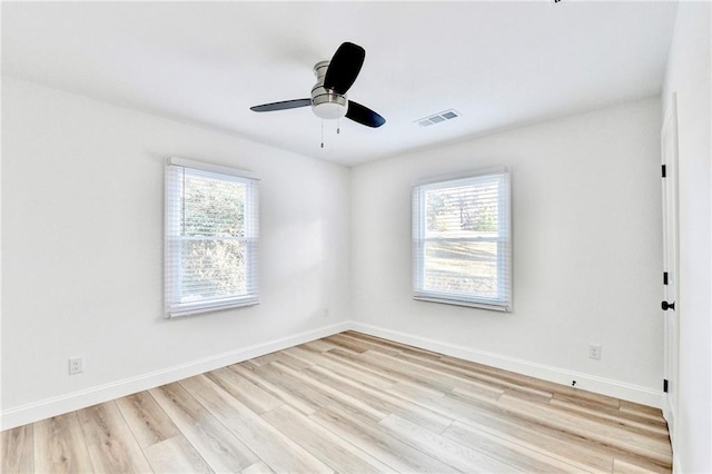 2502 Tupelo St SE, Atlanta, GA 30317 - spare room with light wood-style floors, baseboards, and a ceiling fan