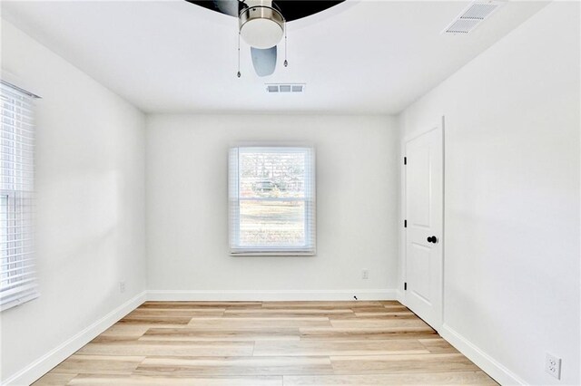 2502 Tupelo St SE, Atlanta, GA 30317 - empty room featuring light wood-type flooring, ceiling fan, and baseboards