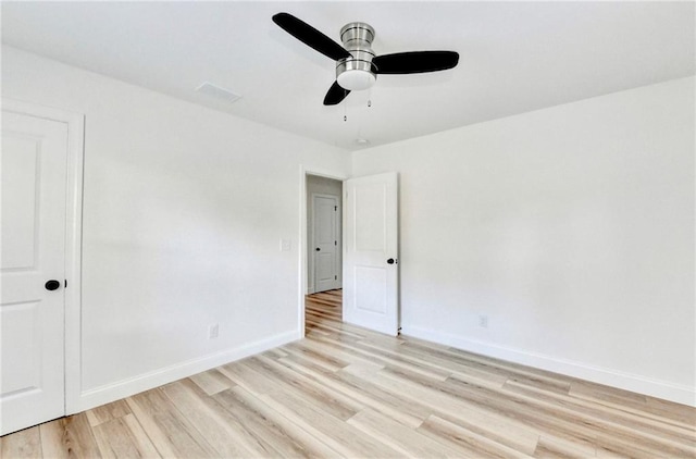 2502 Tupelo St SE, Atlanta, GA 30317 - spare room with light wood-style flooring, baseboards, and ceiling fan