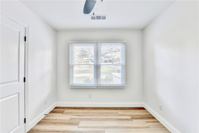 2502 Tupelo St SE, Atlanta, GA 30317 - empty room with light wood finished floors, a ceiling fan, and baseboards