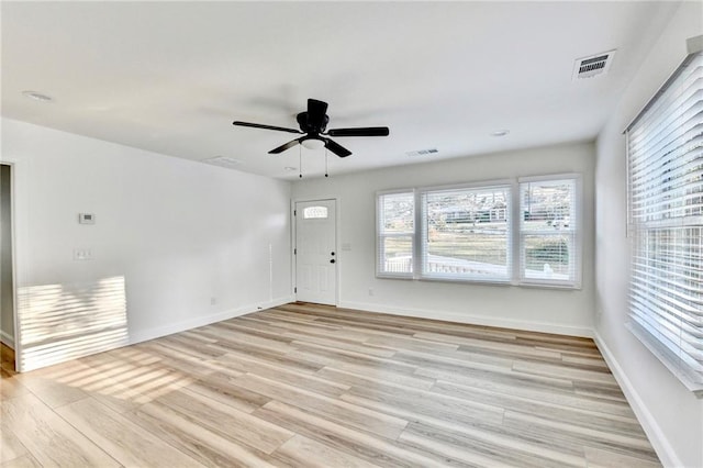 2502 Tupelo St SE, Atlanta, GA 30317 - empty room with light wood-style flooring, baseboards, and a ceiling fan