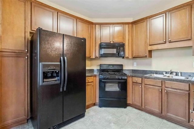 kitchen featuring black appliances and sink