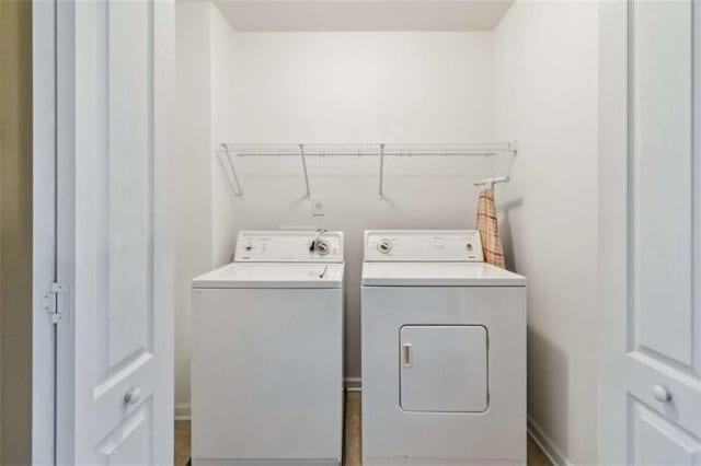 laundry area with separate washer and dryer