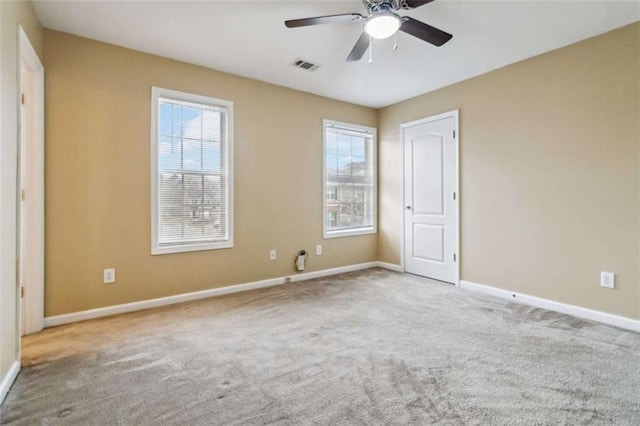 unfurnished bedroom with light colored carpet and ceiling fan