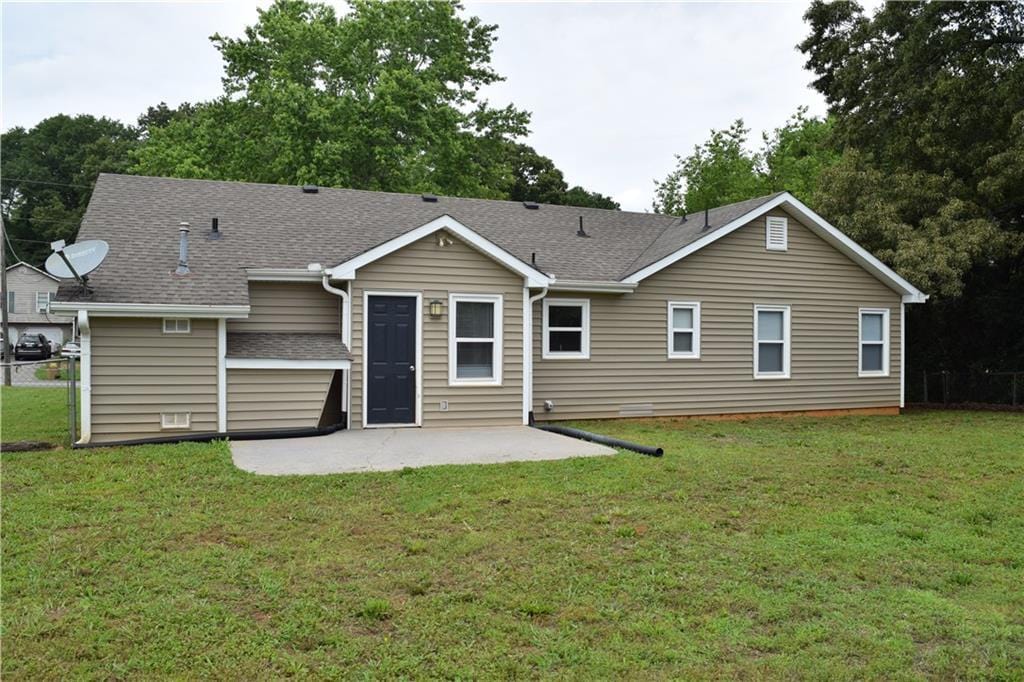 29 Winter Wood Trl, Taylorsville, GA 30178 - rear view of house featuring a patio area, a yard, and roof with shingles