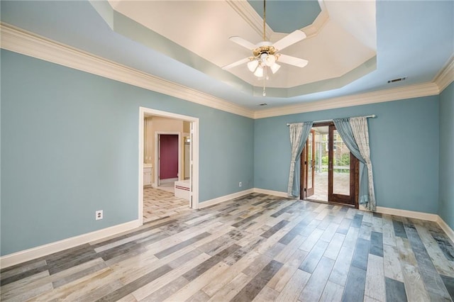 6065 Standard View Dr, Duluth, GA 30097 - unfurnished room featuring a raised ceiling, baseboards, wood finished floors, ceiling fan, and crown molding