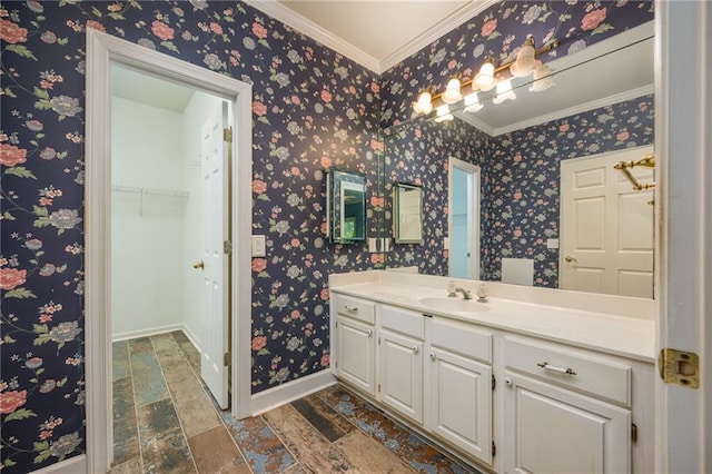 6065 Standard View Dr, Duluth, GA 30097 - bathroom featuring vanity, baseboards, crown molding, a walk in closet, and stone finish flooring
