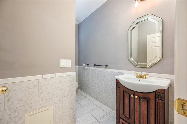 6065 Standard View Dr, Duluth, GA 30097 - bathroom featuring tile walls, vanity, ornamental molding, wainscoting, and tile patterned floors