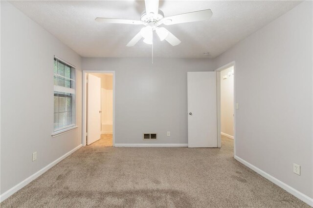 5218 Tina Ct, Stone Mountain, GA 30083 - unfurnished room featuring carpet floors, baseboards, and a ceiling fan