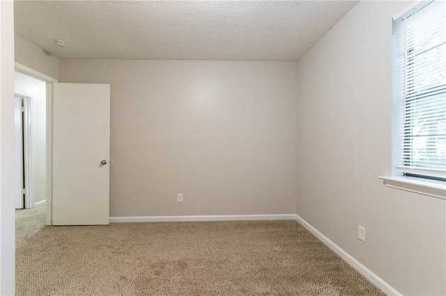 5218 Tina Ct, Stone Mountain, GA 30083 - unfurnished room featuring carpet flooring, a textured ceiling, baseboards, and a smoke detector