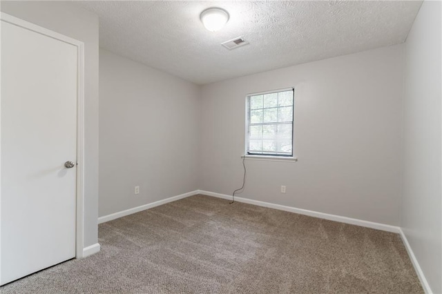 5218 Tina Ct, Stone Mountain, GA 30083 - carpeted spare room featuring a textured ceiling and baseboards