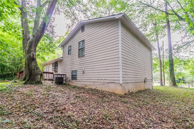 5218 Tina Ct, Stone Mountain, GA 30083 - view of property exterior featuring a wooden deck and cooling unit