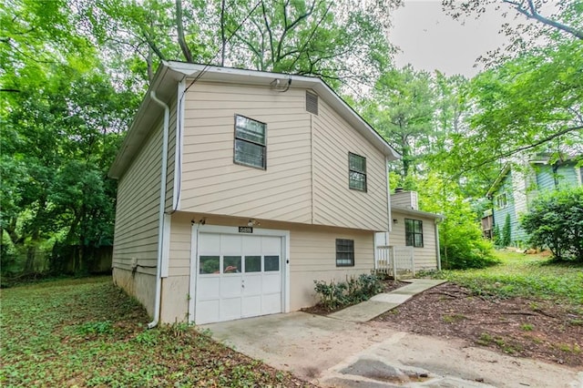 5218 Tina Ct, Stone Mountain, GA 30083 - view of front of home featuring a garage and concrete driveway