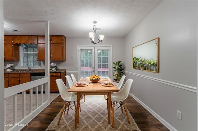 5218 Tina Ct, Stone Mountain, GA 30083 - dining space with dark wood-style floors, a chandelier, and baseboards