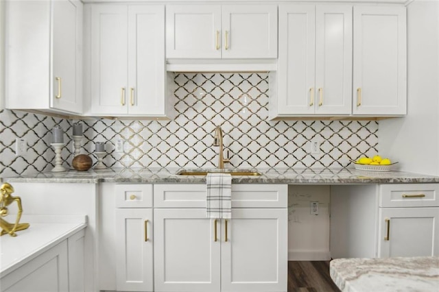 kitchen featuring white cabinets, dark hardwood / wood-style flooring, and sink