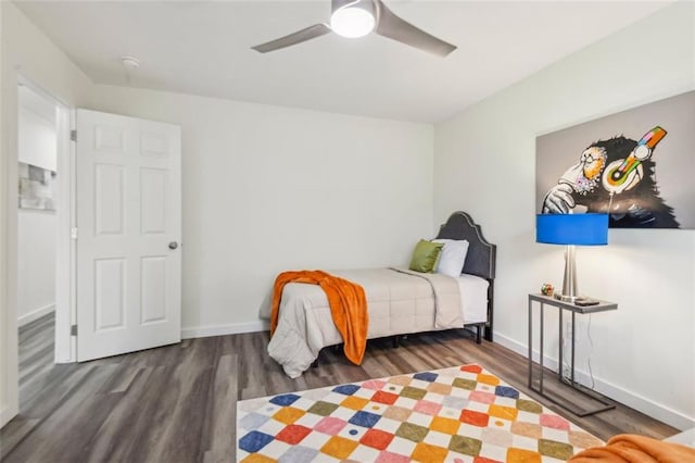 bedroom with wood-type flooring and ceiling fan