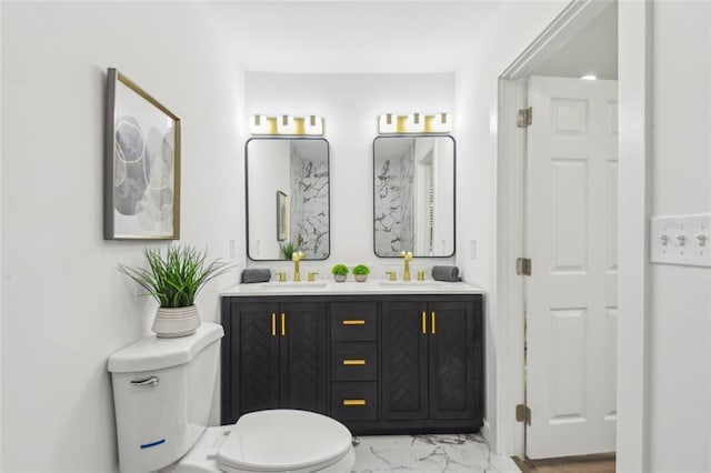 bathroom featuring tile patterned floors, double vanity, and toilet