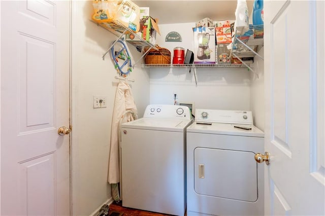 clothes washing area with washing machine and clothes dryer