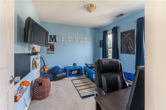 office area featuring carpet floors and a textured ceiling
