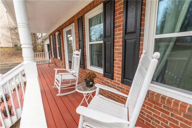 wooden terrace featuring a porch